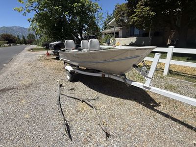 12 ft Crestliner Aluminum Fishing Boat with Evinrude Motor and Trailer