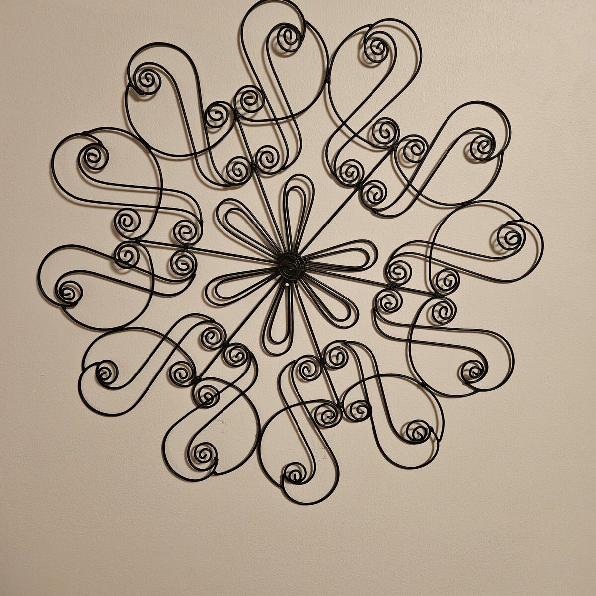 Black metal flower wall hanging, new