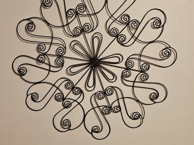 Black metal flower wall hanging, new