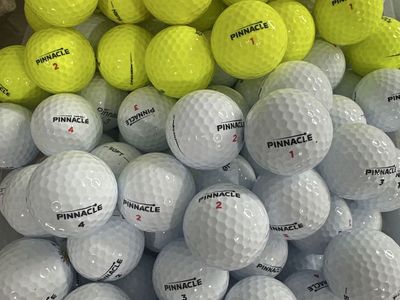 250 Like New Pinnacle Golf Balls in stock