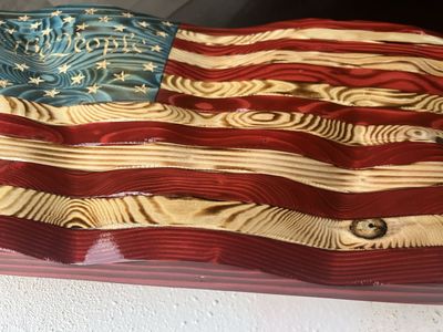Hand carved wavy wood flag we the people