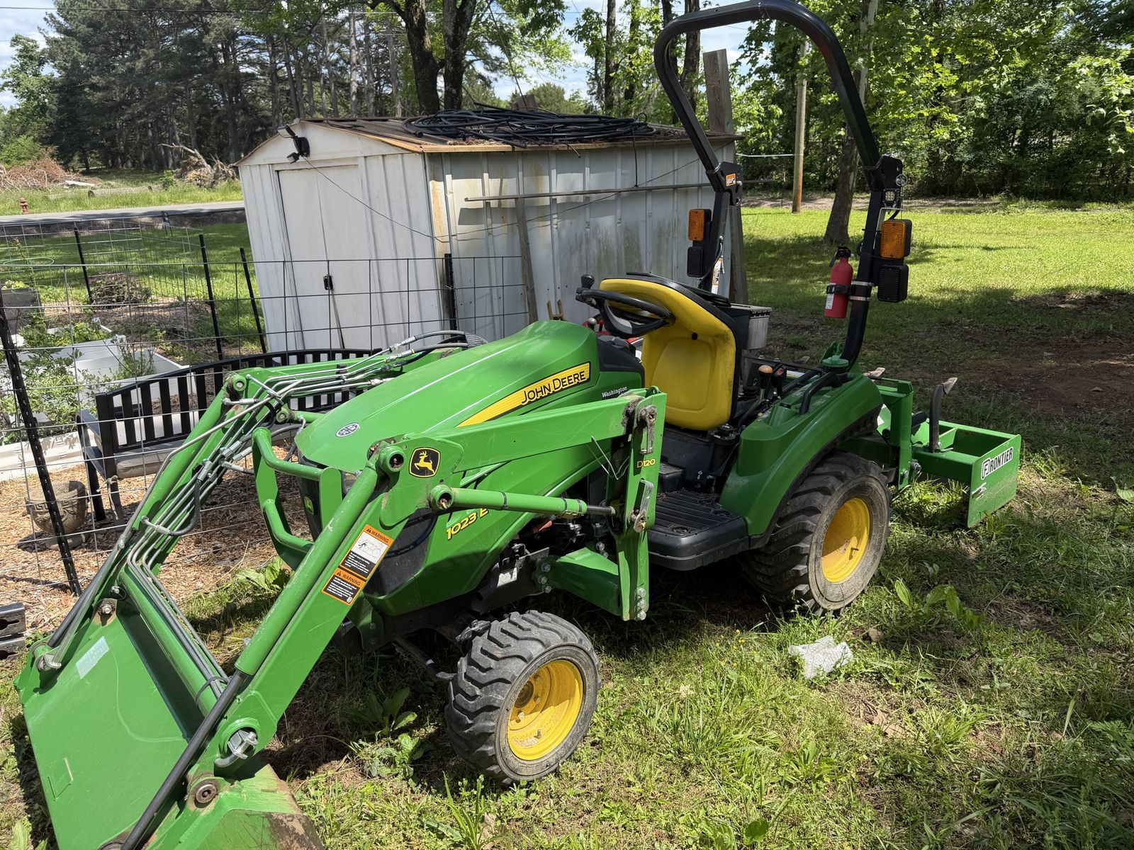 John Deere 1023E Sub-Compact Tractor with Loader, Box Blade and Tiller.