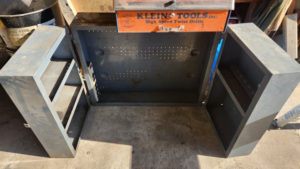heavy-duty vintage industrial steel wall cabinet with pegboard backing,