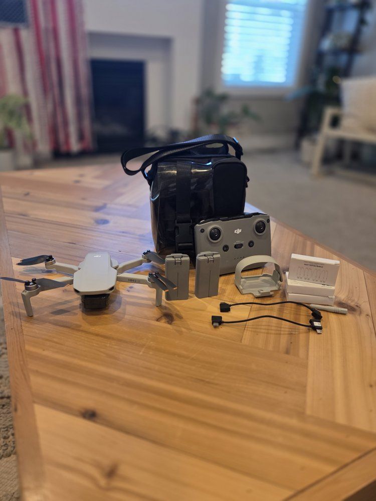 DJI mini 2 SE with remote 2 batteries  carrying case basically brand new