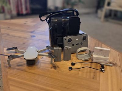 DJI mini 2 SE with remote 2 batteries carrying case basically brand new
