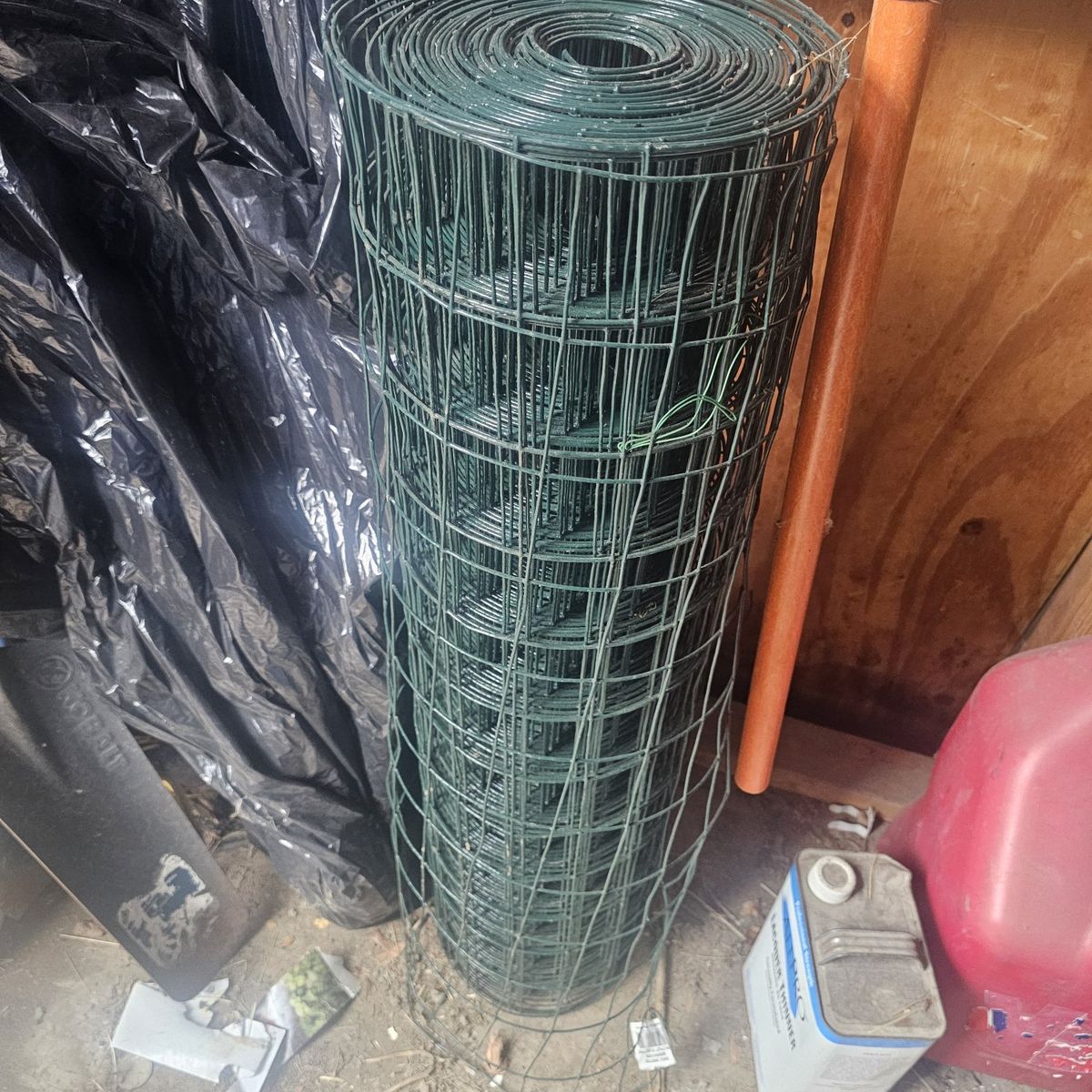 Assorted Rolls of Wire: Farm Gard Electric Fence Wire, Hillman Galvanized Wire, and PVC Coated Wire