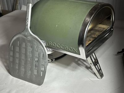 Gozney roccbox pizza oven with carry cover and peel