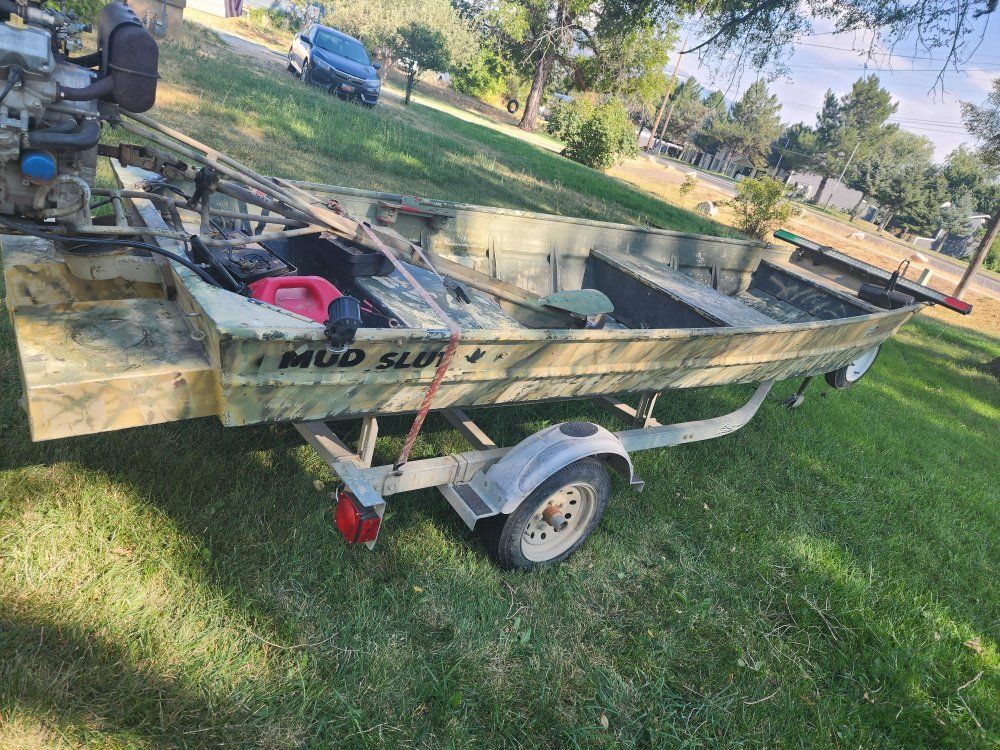 Jon Boat with Mud Buddy Motor and Trailer