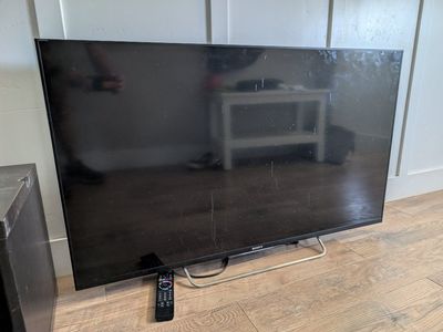 Sony Bravia Smart TV, 50-inch, Black with Remote, Power Cable, and universal VESA mount adapter.