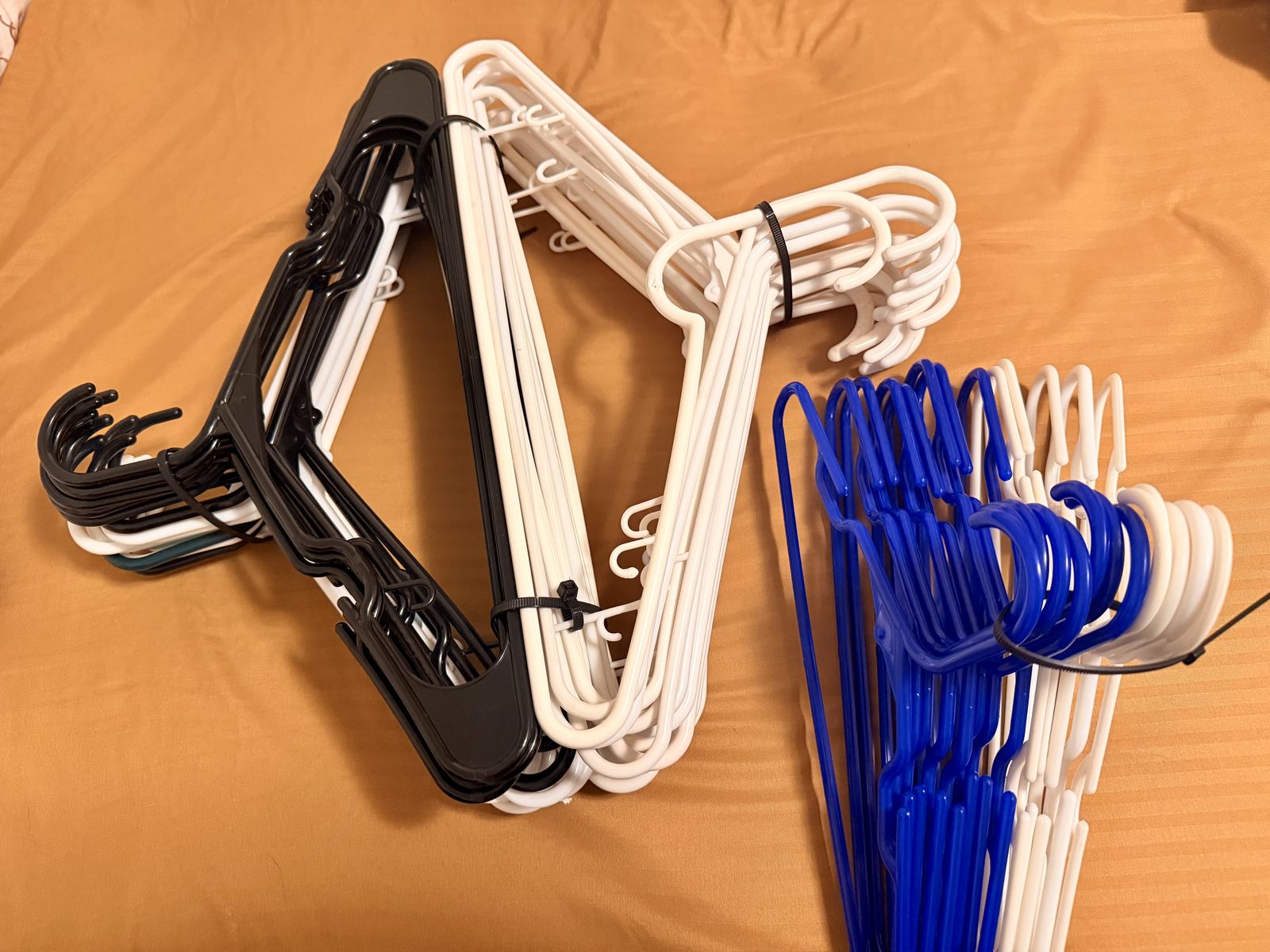 Little hangers and big hangers, 51 total, blue, black, white
