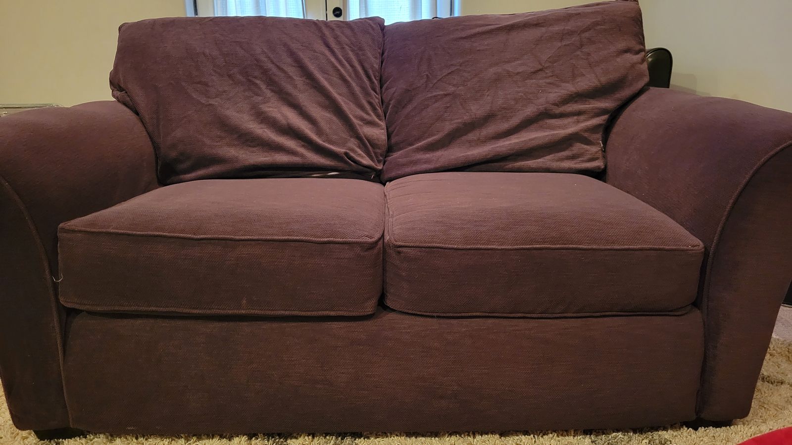 Plumb colored love seat, oversized chair and ottoman