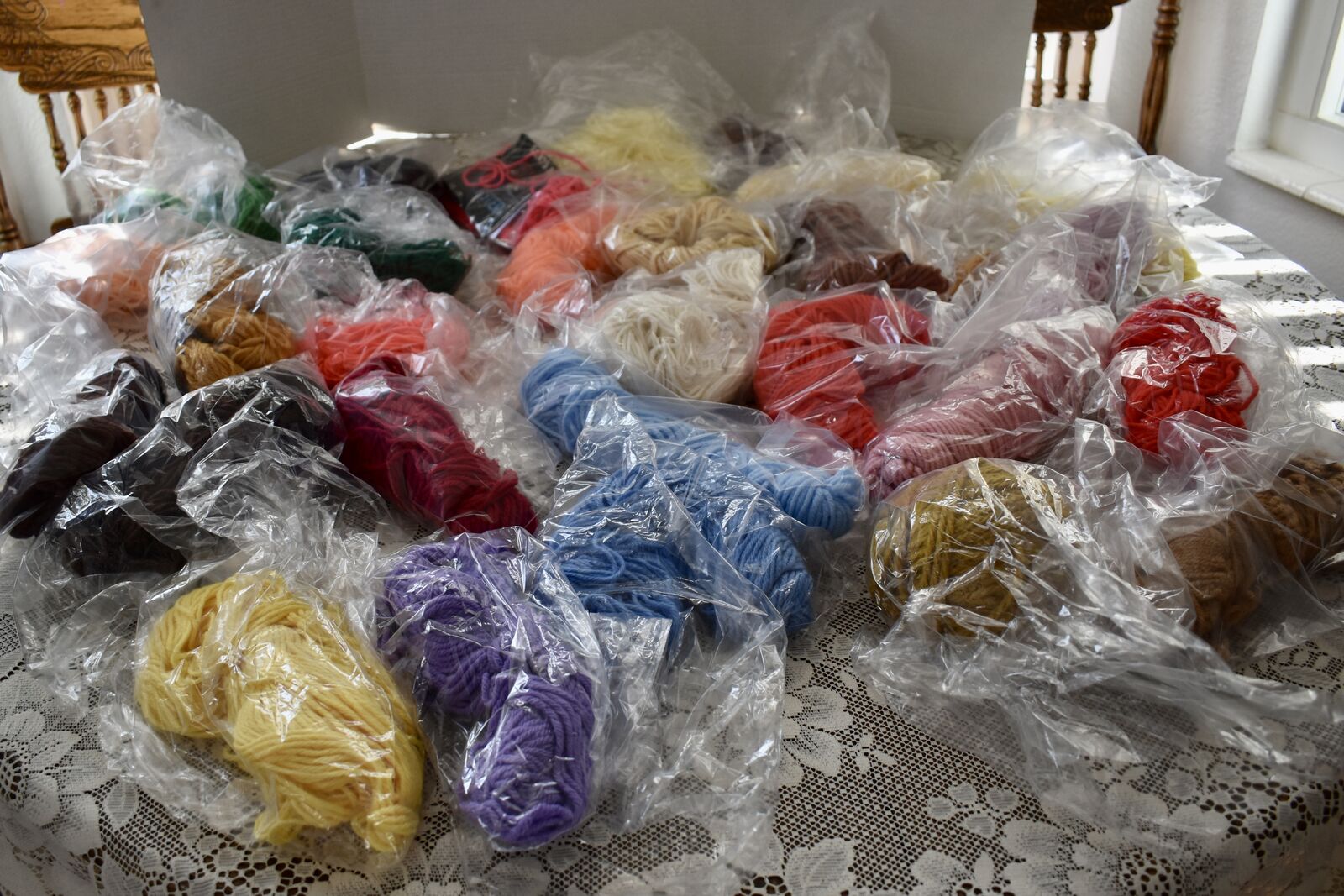 SEVERAL BALLS OF VINTAGE YARN PIECES THAT HAVE HAD HALF OR MORE OF IT LEFT TO STILL USE