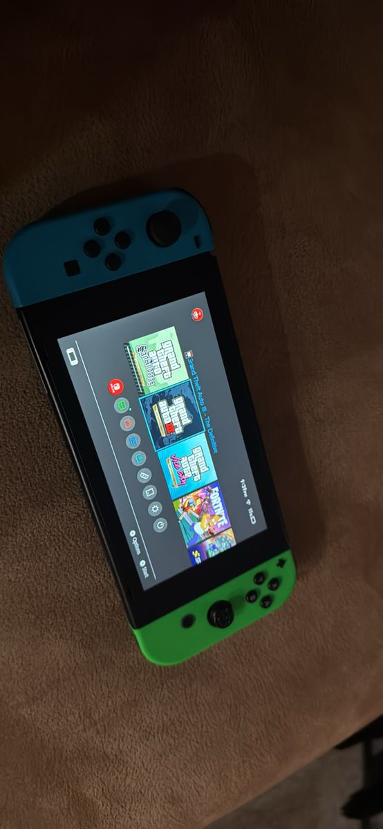 Nintendo Switch Console with Blue and Green Joy-Con Controller no dock but has charger