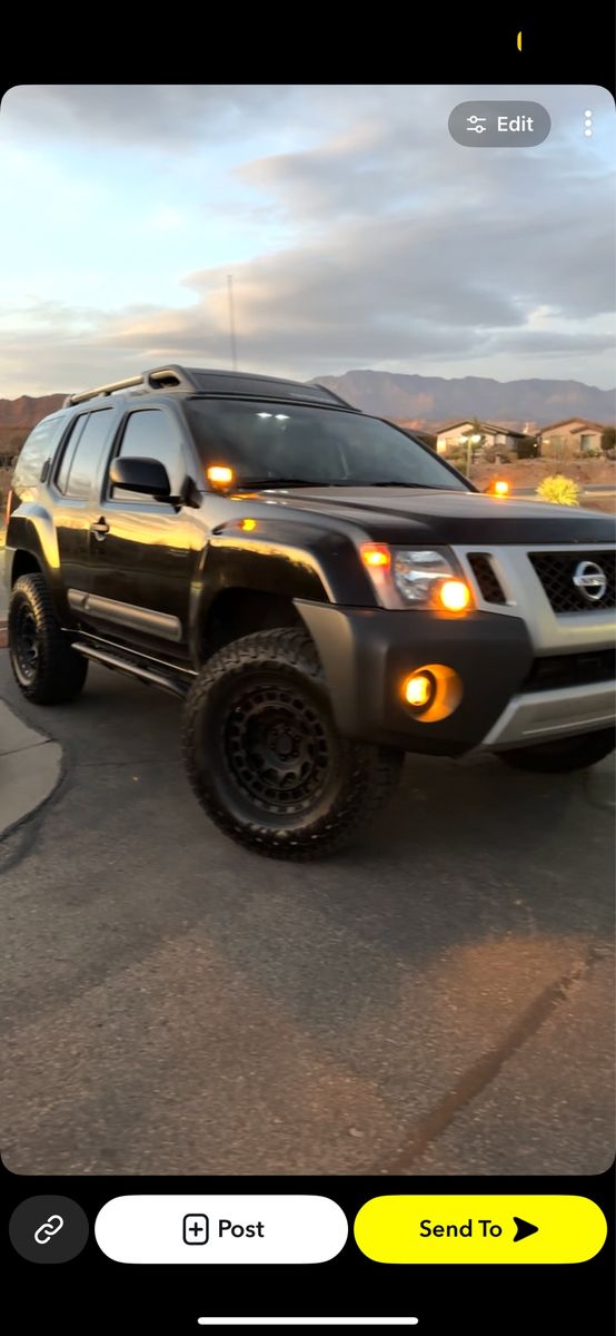 Nissan Xterra Off-Road with Rooftop Tent
