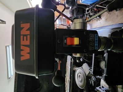 Drill press with table