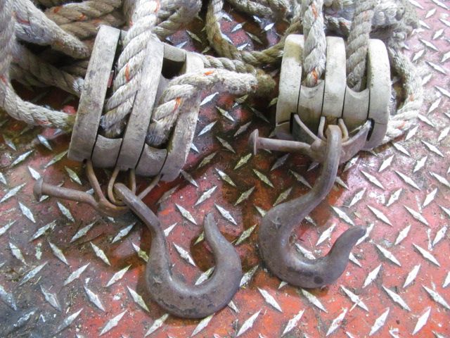 Antique block and tackle. 2 pulleys and rope