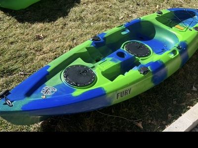 2 kayaks and small boat