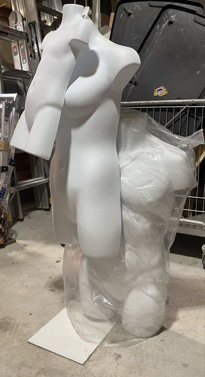 3 hard plastic hanging torso mannequins with white adjustable costumer stand in great condition.