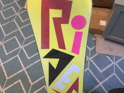 Kids ride snowboard