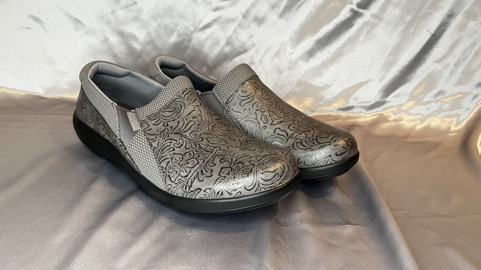 Ladies Alegria Silver and Black flower design slip in shoes. Ladies size 9