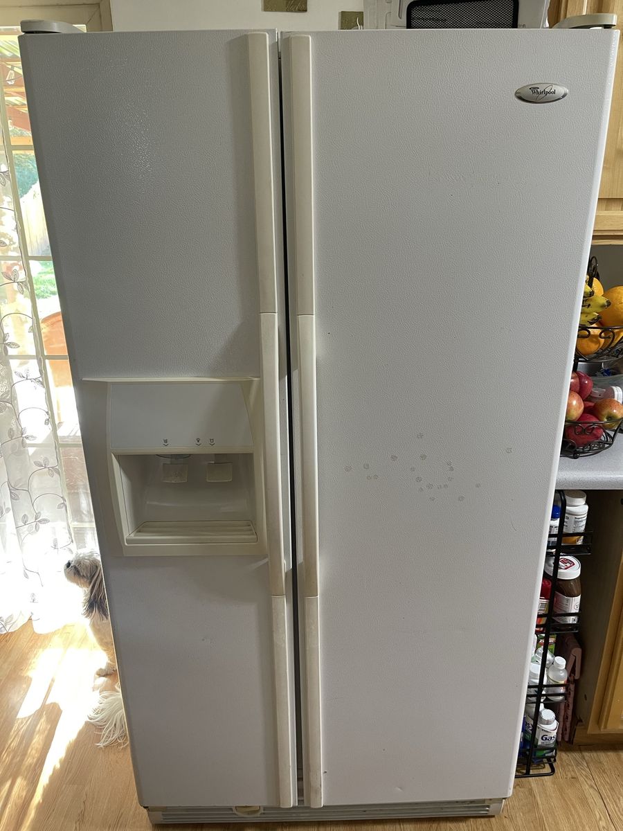 white Whirlpool side by side refrigerator
