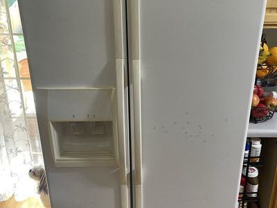 white Whirlpool side by side refrigerator
