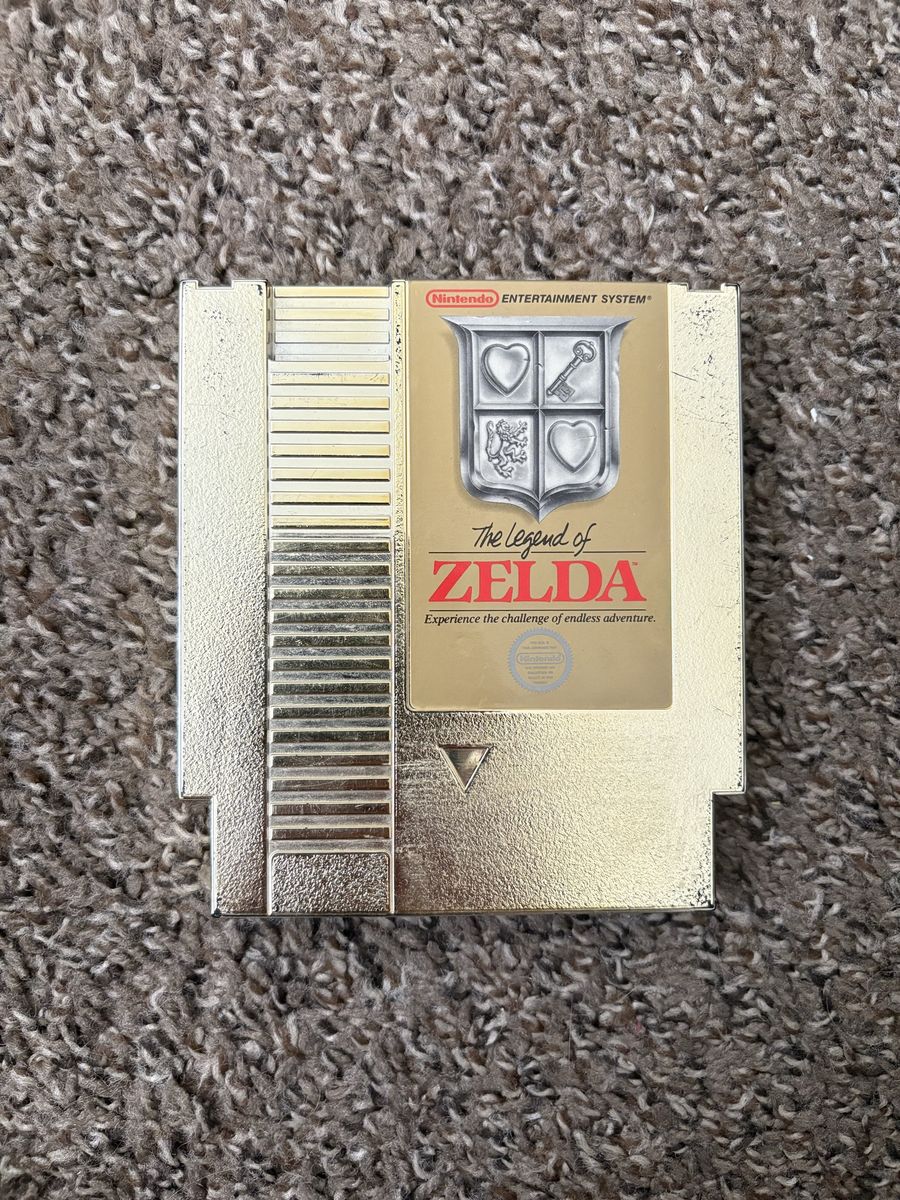 Original gold cartridge legend of Zelda in good working condition for the NES.