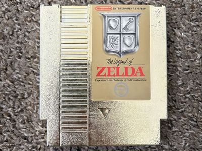 Original gold cartridge legend of Zelda in good working condition for the NES.