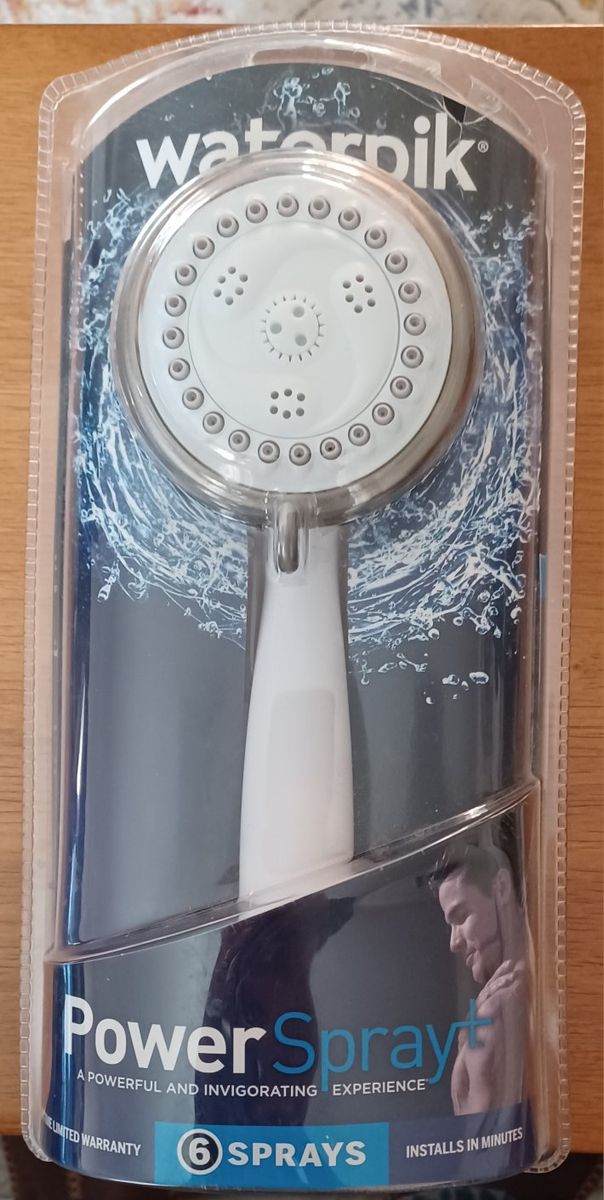 NEW Shower Head. Hand held or hang on wall.