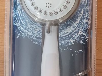 NEW Shower Head. Hand held or hang on wall.