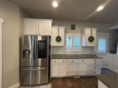 Full kitchen cabinets and appliances excluding Fridge