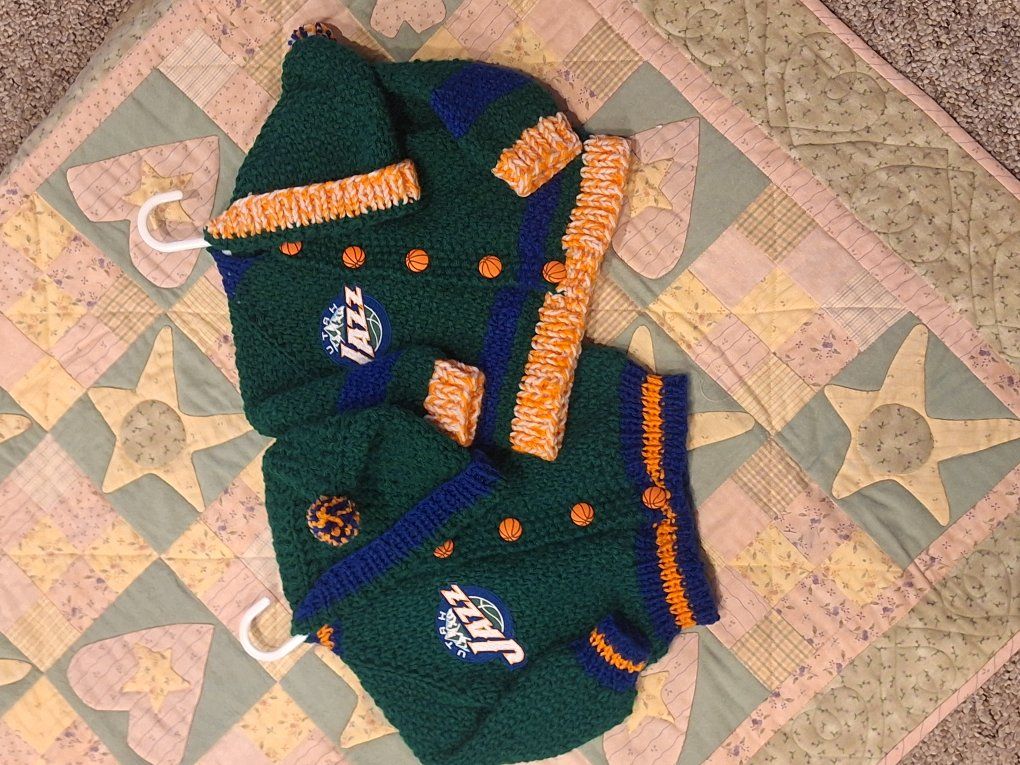 Baby sweaters for UofU, BYU, and Utah Jazz fans.