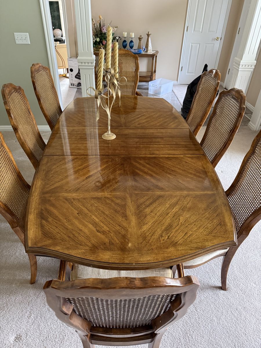 Vintage French Provincial Dining Set: Expandable Table, 9 Cane Back Chairs, and Matching Buffet.