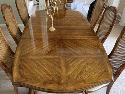 Vintage French Provincial Dining Set: Expandable Table, 9 Cane Back Chairs, and Matching Buffet.