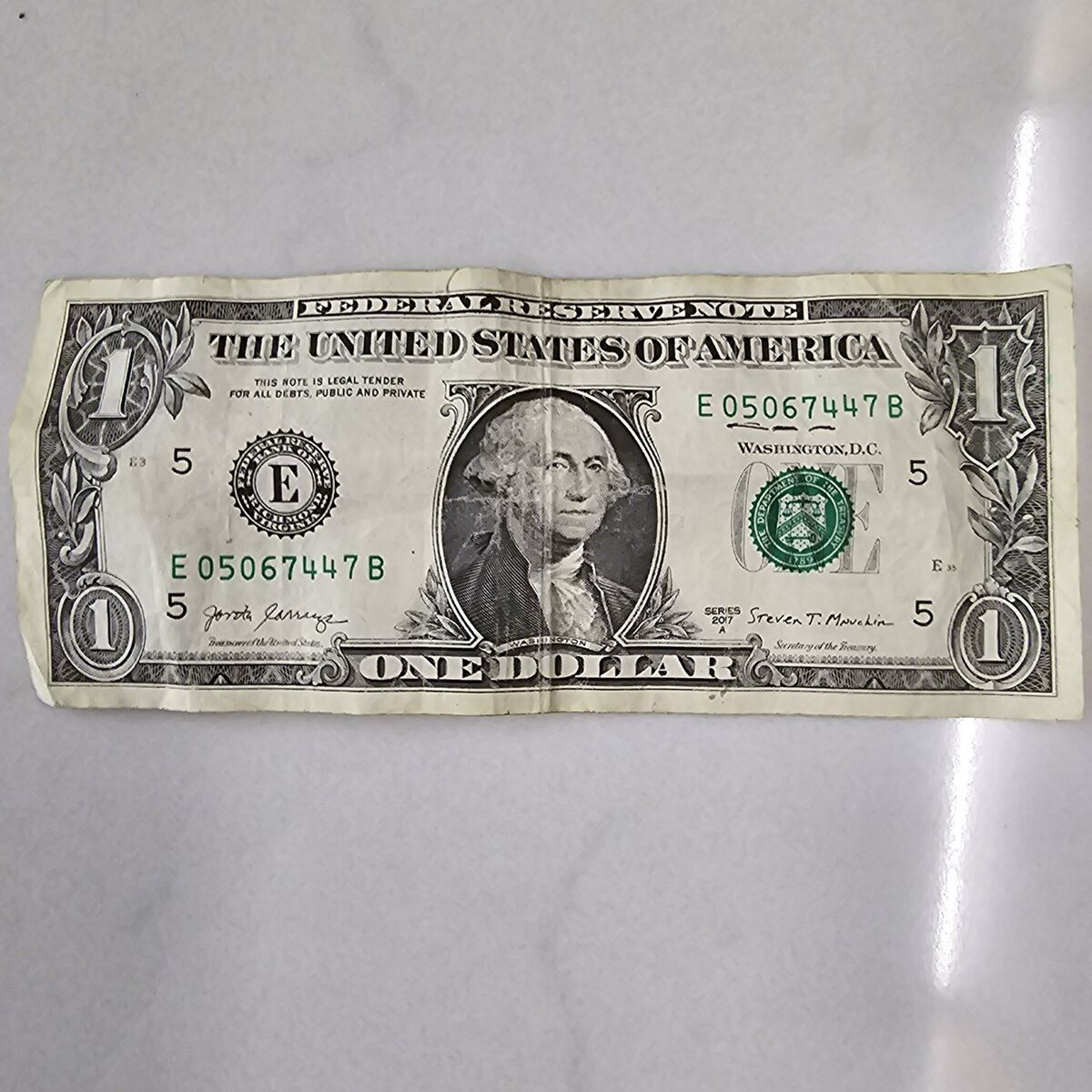 One dollar bill with 05/06/74