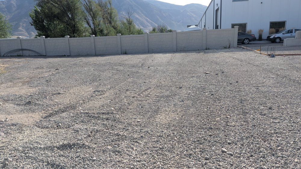 Semi truck parking gravel yard.