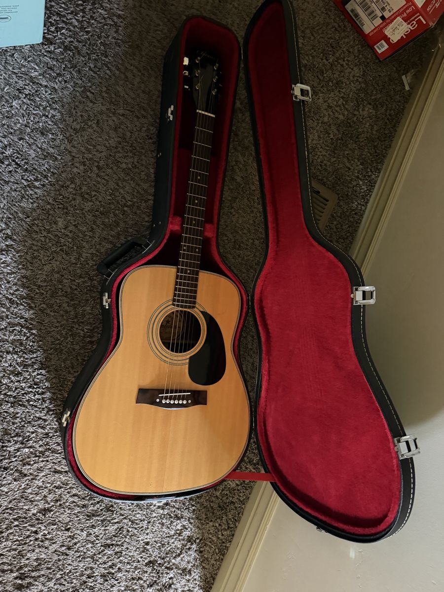 Vintage Antares acoustic guitar with hard shell case. Clean condition, good action, ready to play.