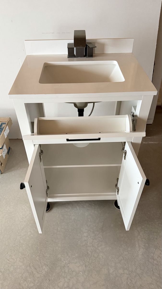 White Bathroom Vanity with Countertop, Sink, and Dark Hardware