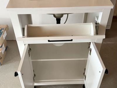 White Bathroom Vanity with Countertop, Sink, and Dark Hardware