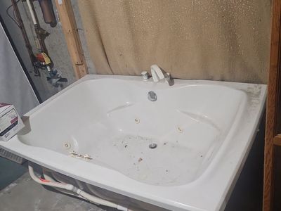 Jetted Bathtub with Pump and Faucet Fixtures