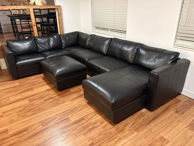 Black IKEA Bomstad Leather Sectional Sofa with Pull-Out Bed, Chaise Storage and Storage Ottoman