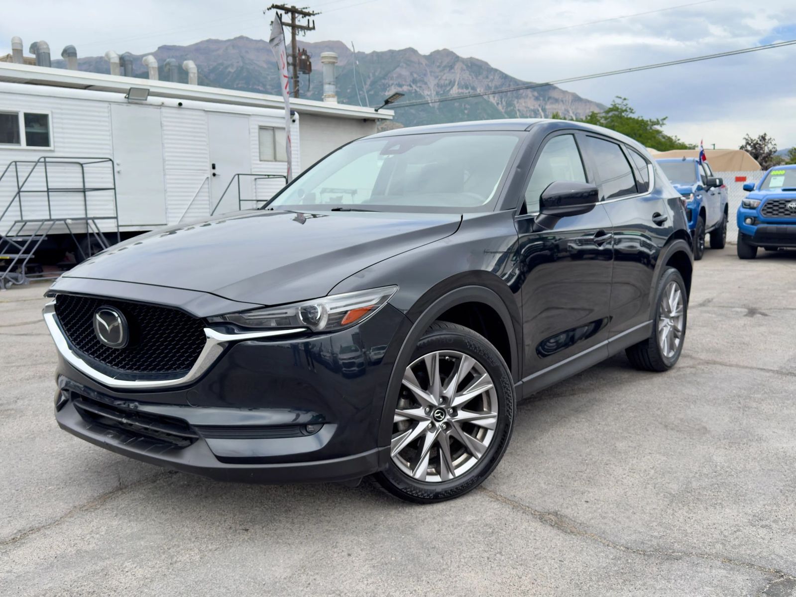 2019 Mazda CX-5 Grand Touring — rebuilt & branded title, 32% below market