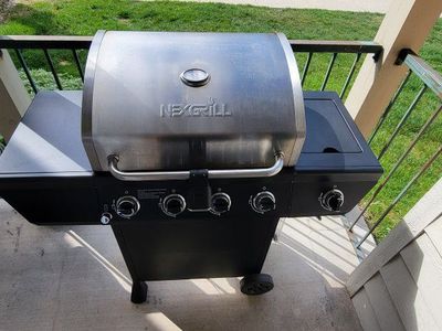 Nexgrill 4-Burner Propane Gas Grill with Stainless Steel Lid & Side Burner