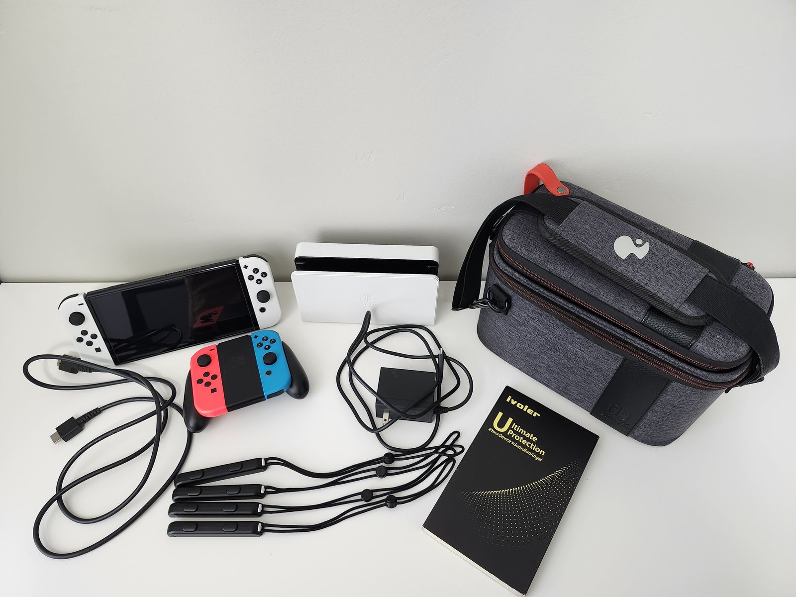 Nintendo Switch OLED + Carrying Case + Screen Protectors + 2 Extra Joy-Cons