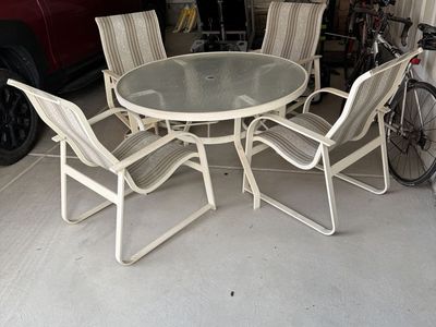 Four Lawn Chairs and Round Table