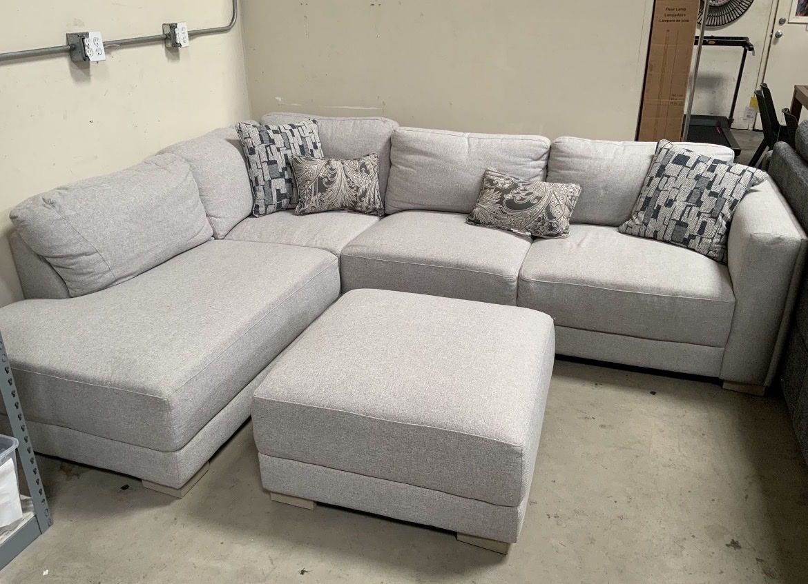 Need gone Gray Costco section ottoman