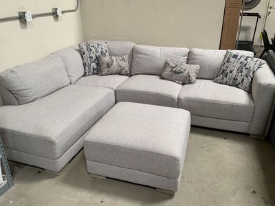 Need gone Gray Costco section ottoman