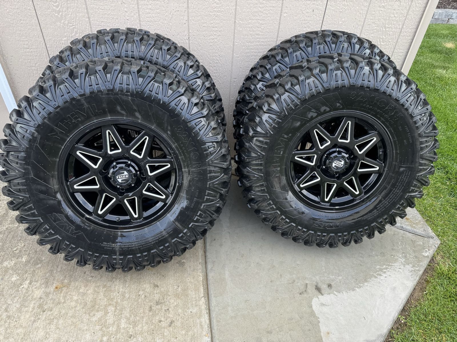 32x10r15. 4/136 bolt pattern and Evil tire 8 ply,excellent condition