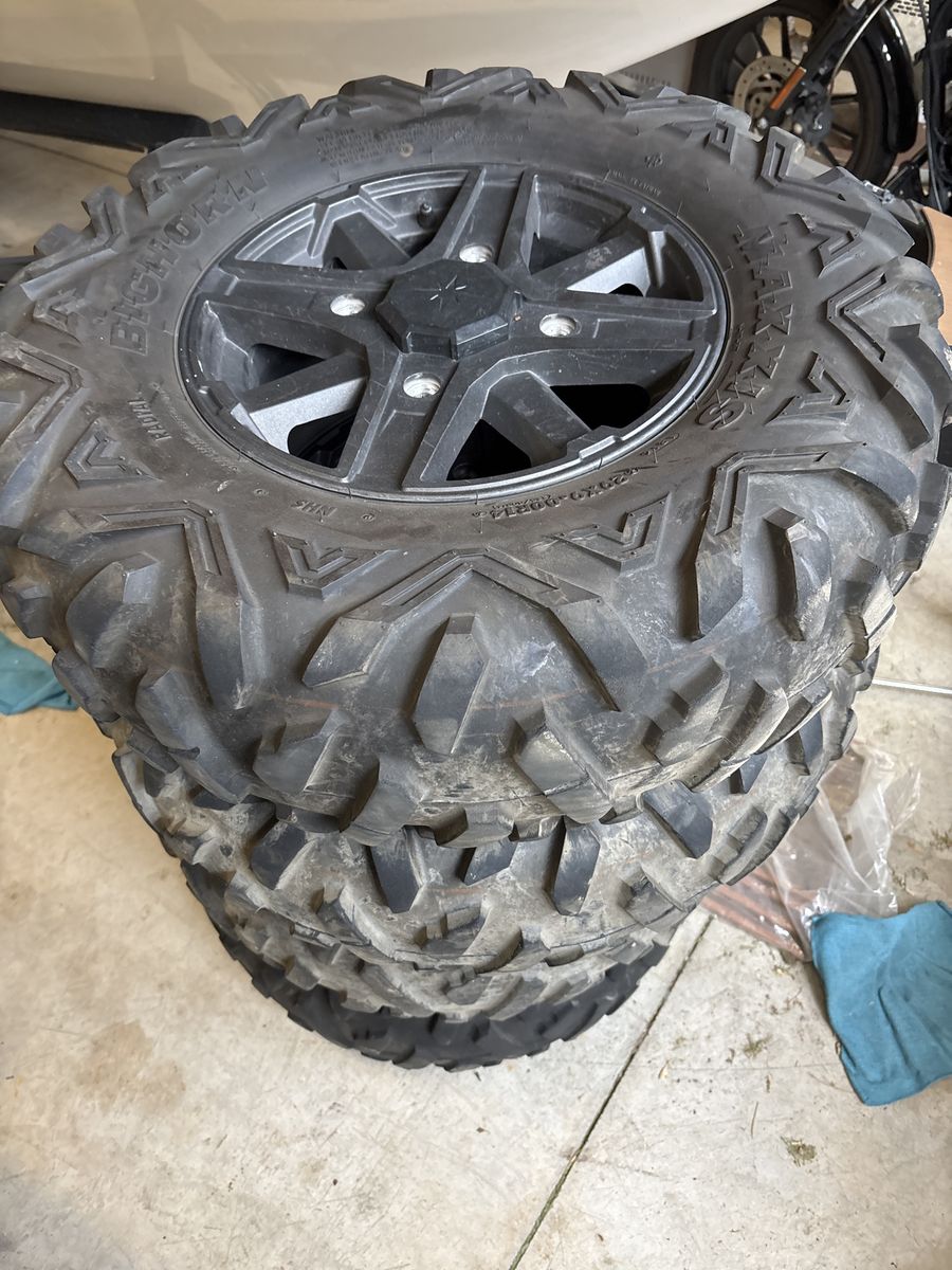 Tires and rims off Polaris RZR 1000.