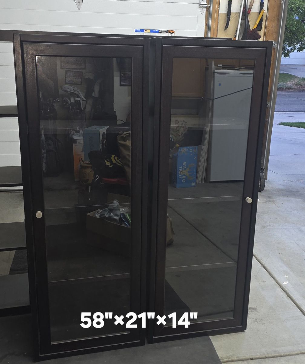 (2) Nice real wood black cabinets with glass doors